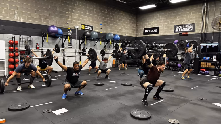 Olympic lifting on the Sand & Steel Fitness training floor — professional workout programming in Alexandria VA